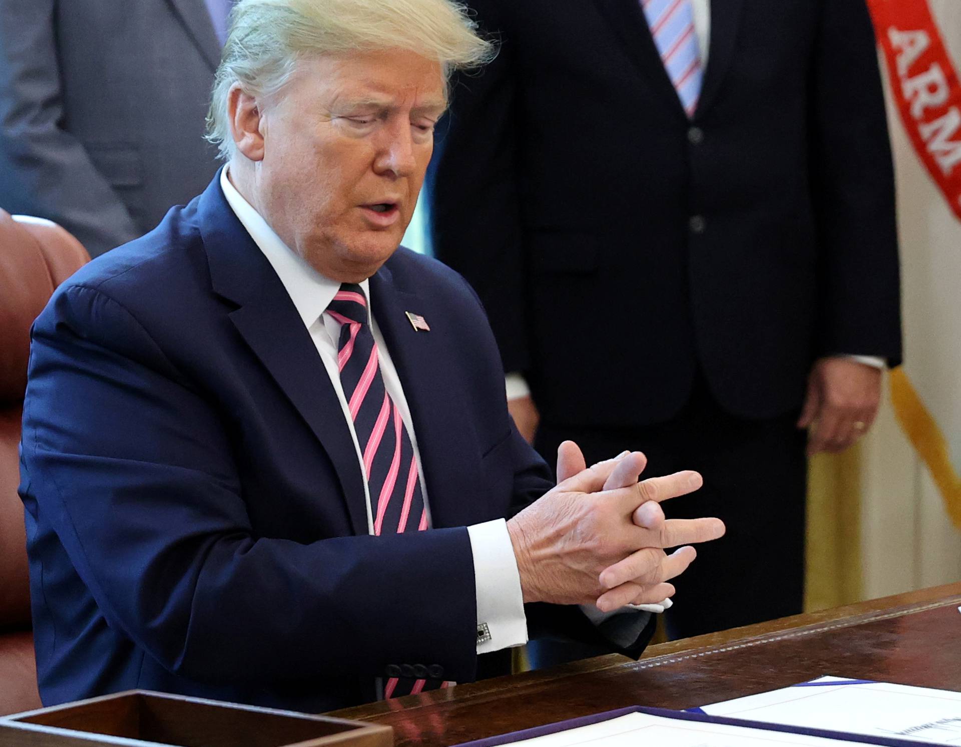 U.S. President Trump signs the Paycheck Protection Program and Health Care Enhancement Act response to the coronavirus disease outbreak at the White House in Washington