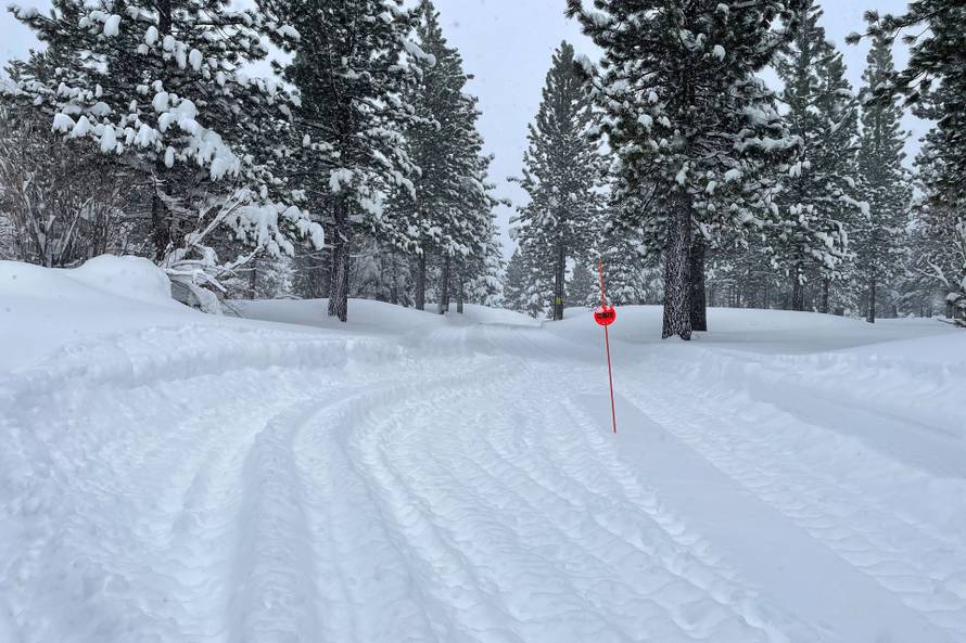 Rescue teams deploy to the site of an avalanche in a backcountry slope of California's Sierra Nevada mountains