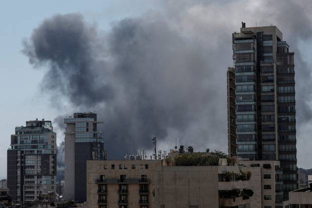 Smoke and dust rise following an Israeli strike in Beirut