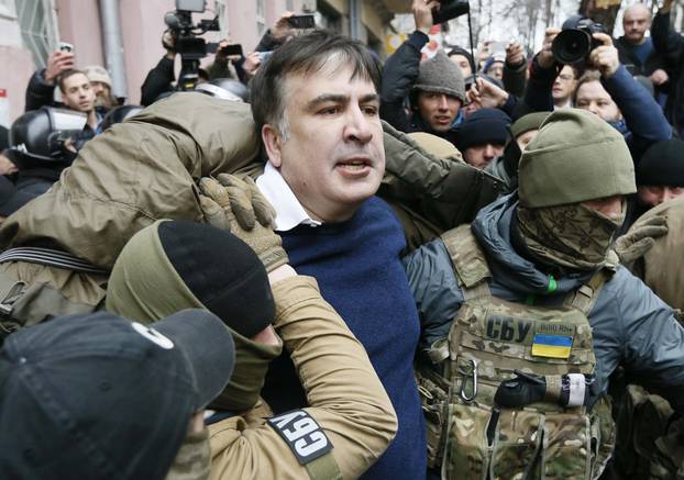 Georgian former President Mikheil Saakashvili is detained by officers of the Security Service of Ukraine, conducting a search of his apartment, in Kiev
