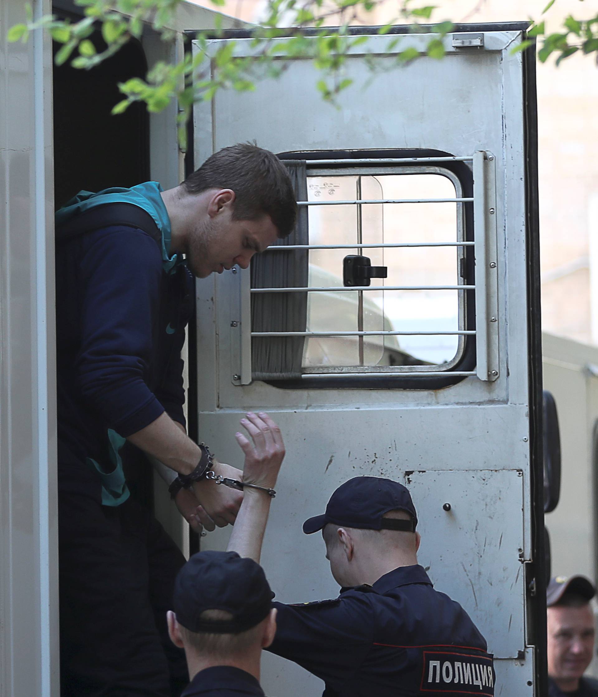 Russian soccer player Kokorin walks out of a truck before a court hearing in Moscow
