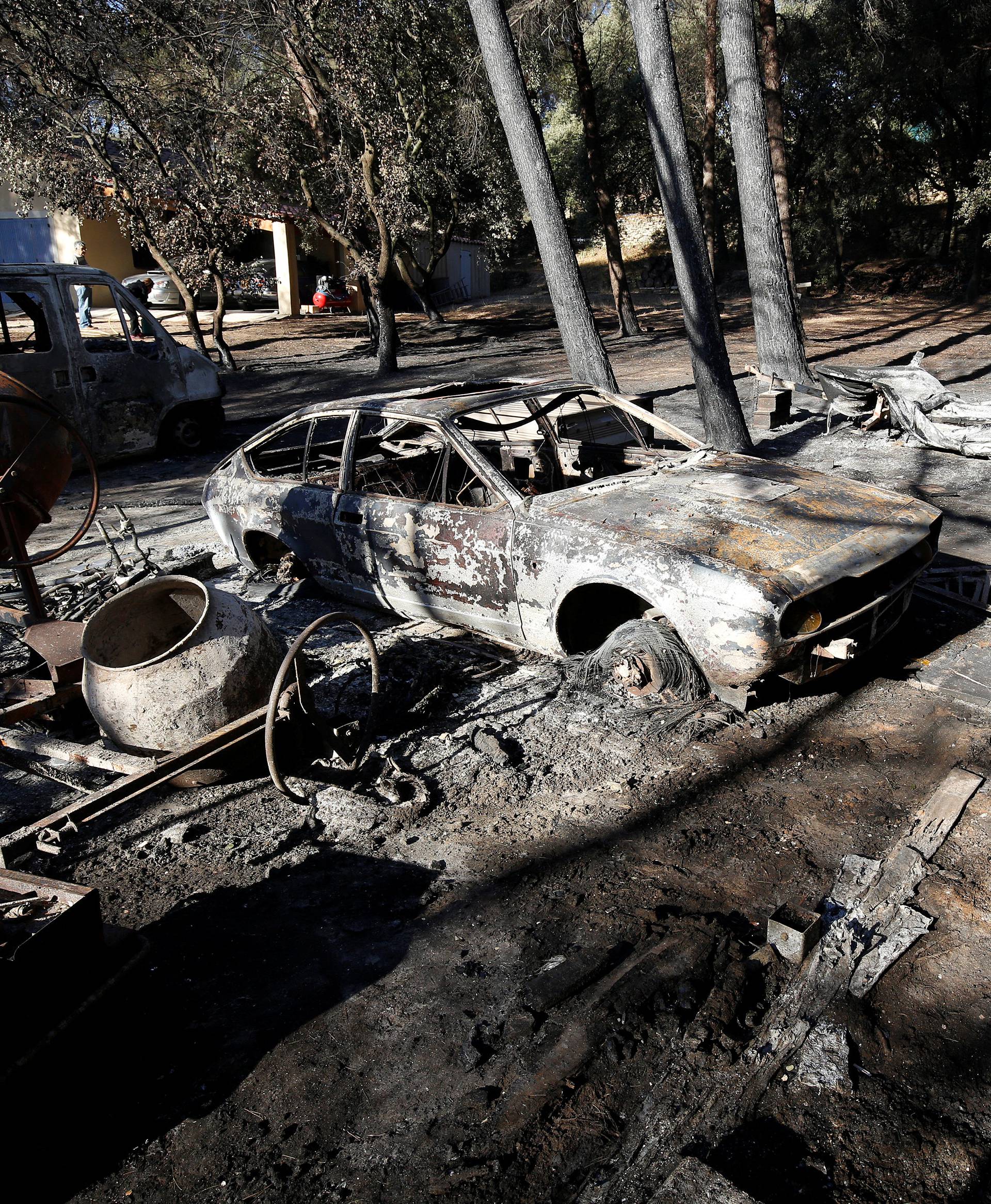 Destroyed cars are seen the day after fires, fanned by strong northern winds known as the mistral, ravaged more than 2,000 hectares of the dry, pine-planted hills north of Marseille