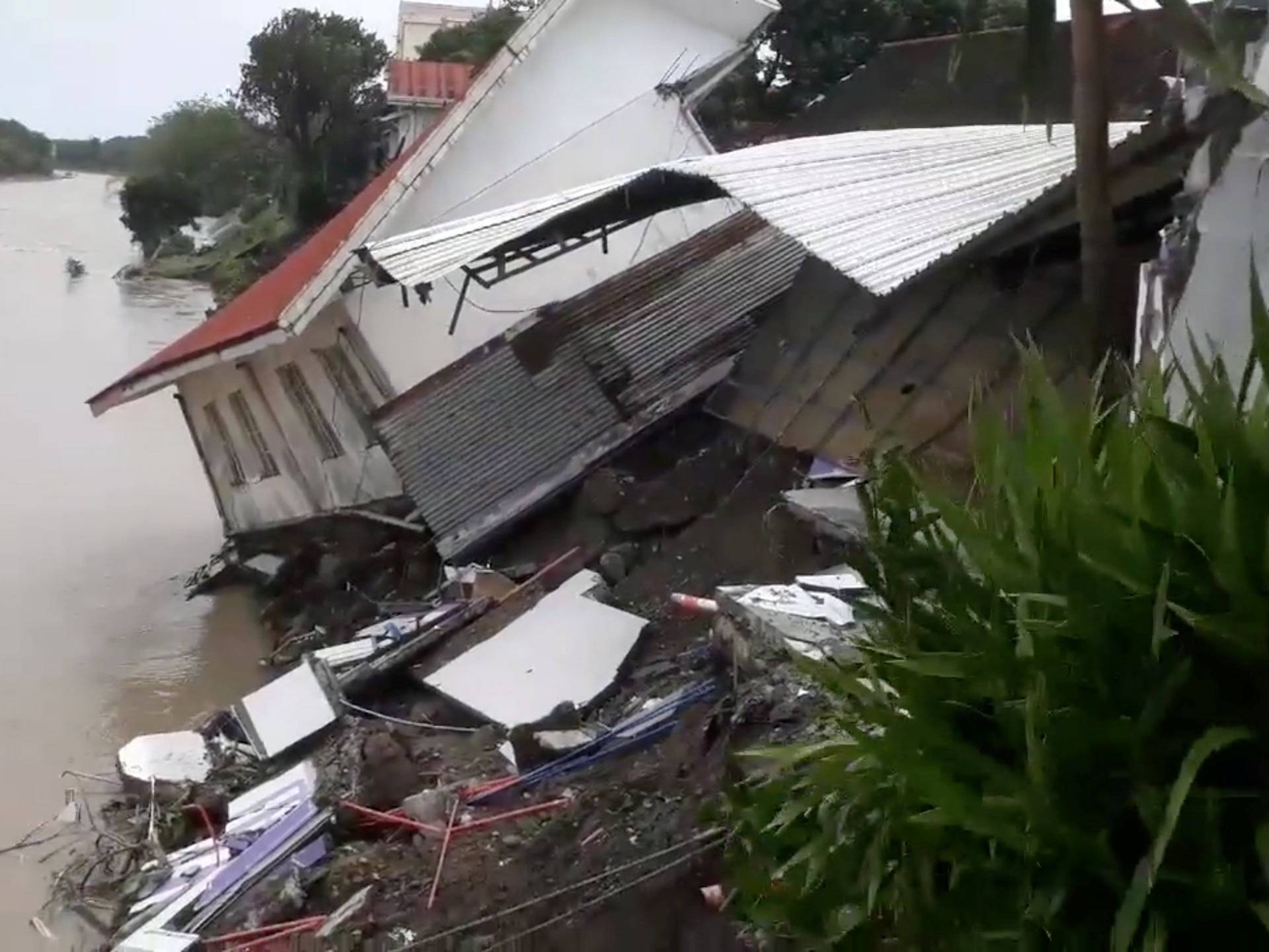 A destroyed house is seen after a tropical depression descended upon Daet, Camarines Norte
