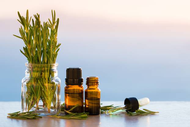 Rosemary aromatherapy essential oils in bottles