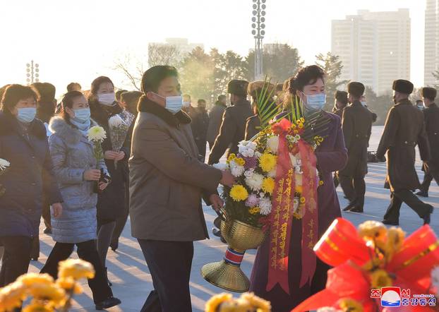 People pay tribute to late leader Kim Jong Il in commemoration of 9th anniversary of his death in Pyongyang