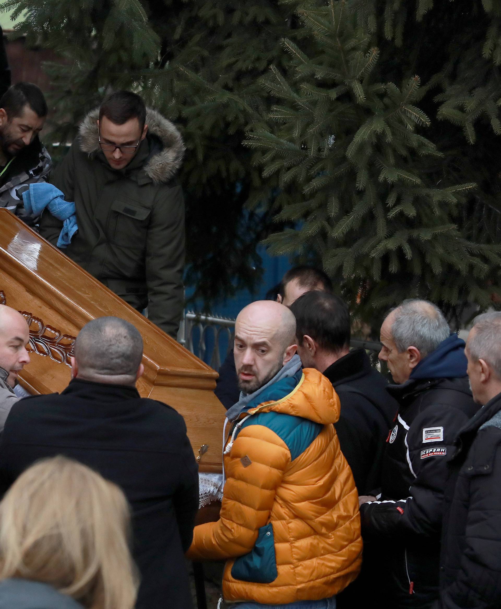 Men carry the coffin with the body of Oliver Ivanovic before cortege travel to the northern outskirts of Kosovska Mitrovica
