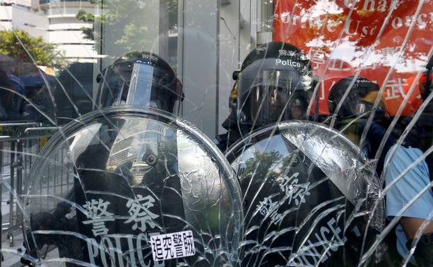 Riot police is seen inside the Legislative Council building where protesters try to break into, during the anniversary of Hong Kong