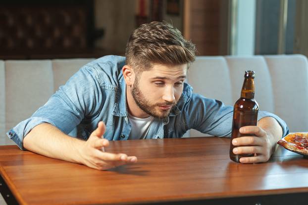 man sitting at the table in the cafe