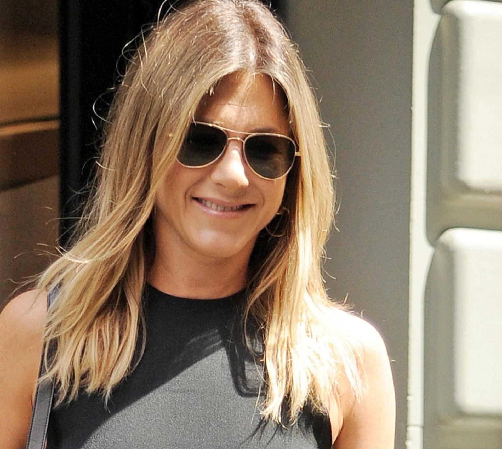 A braless Jennifer Aniston is all smiles after lunch at Le Bilboquet in New York