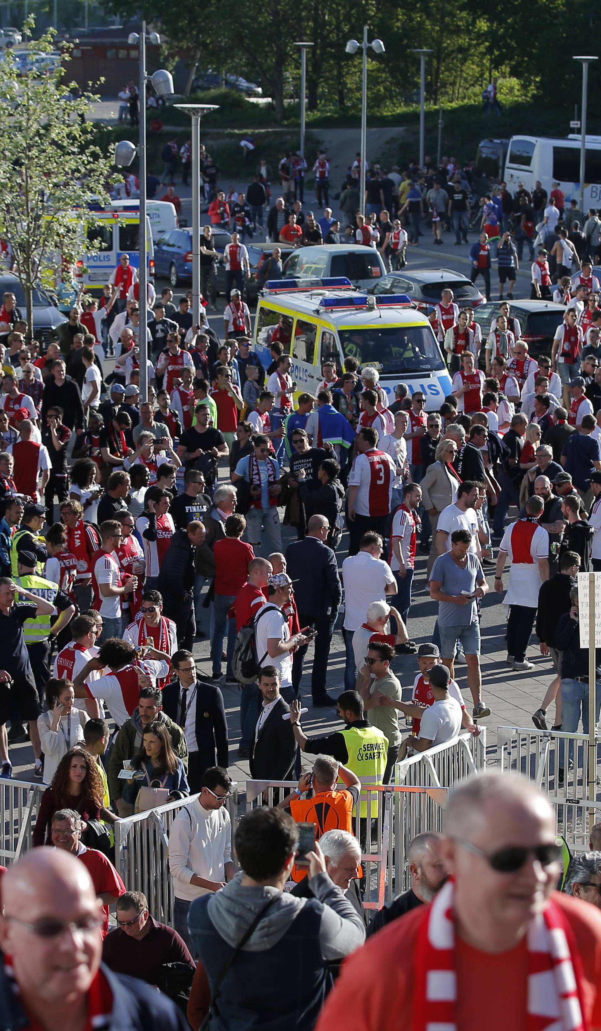 Fans and security outside the stadium before the match