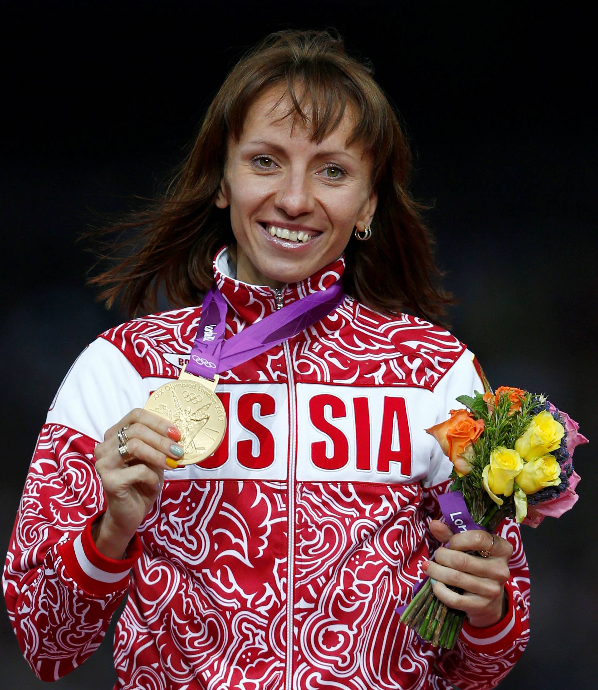 FILE PHOTO: Russia's Savinova holds her gold medal during the women's 800m victory ceremony at the London 2012 Olympic Games