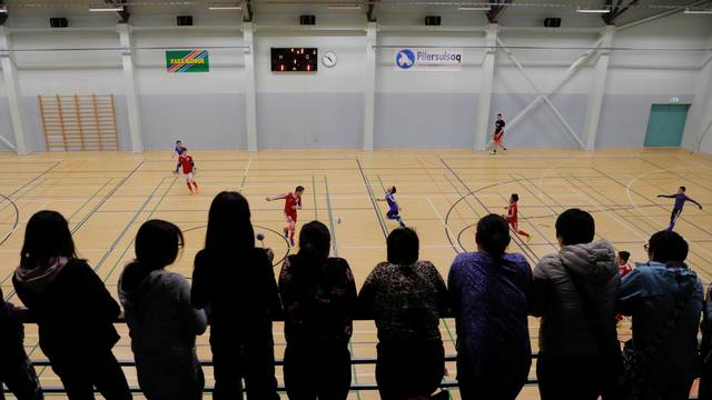 Residents watch an indoor soccer tournament in Tasiilaq, Greenland