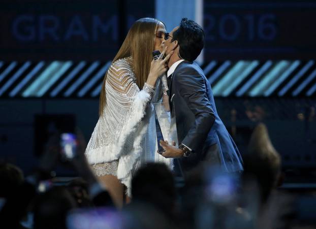 Lopez kisses Anthony after she presented him with award honoring him as Latin Recording Academy person of the year at the 17th Annual Latin Grammy Awards in Las Vegas