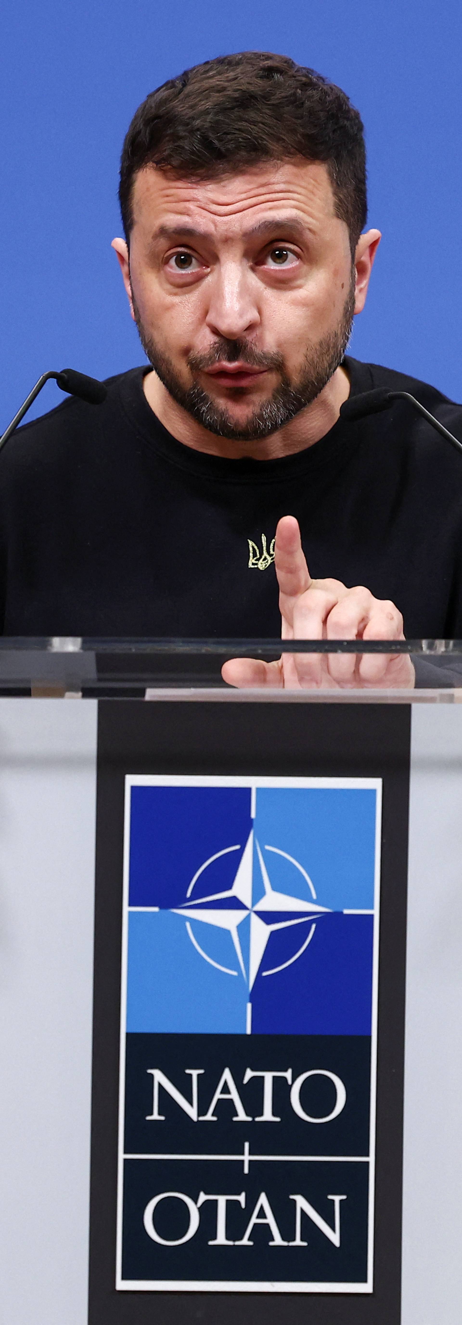 Ukraine's President Volodymyr Zelenskiy attends a press conference, in Brussels