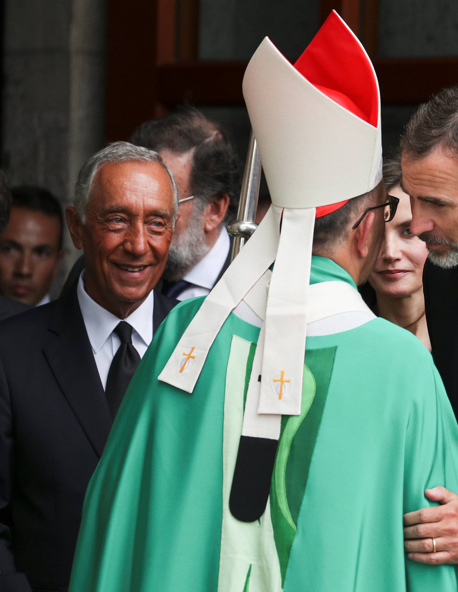 Portuguese president Marcelo Rebelo de Sousa, King Felipe of Spain and his wife Letizia talk with Archbishop Juan Jose Omella after the High mass in the Basilica of the Sagrada Familia in memory of the victims of the van attack at Las Ramblas in Barcelona