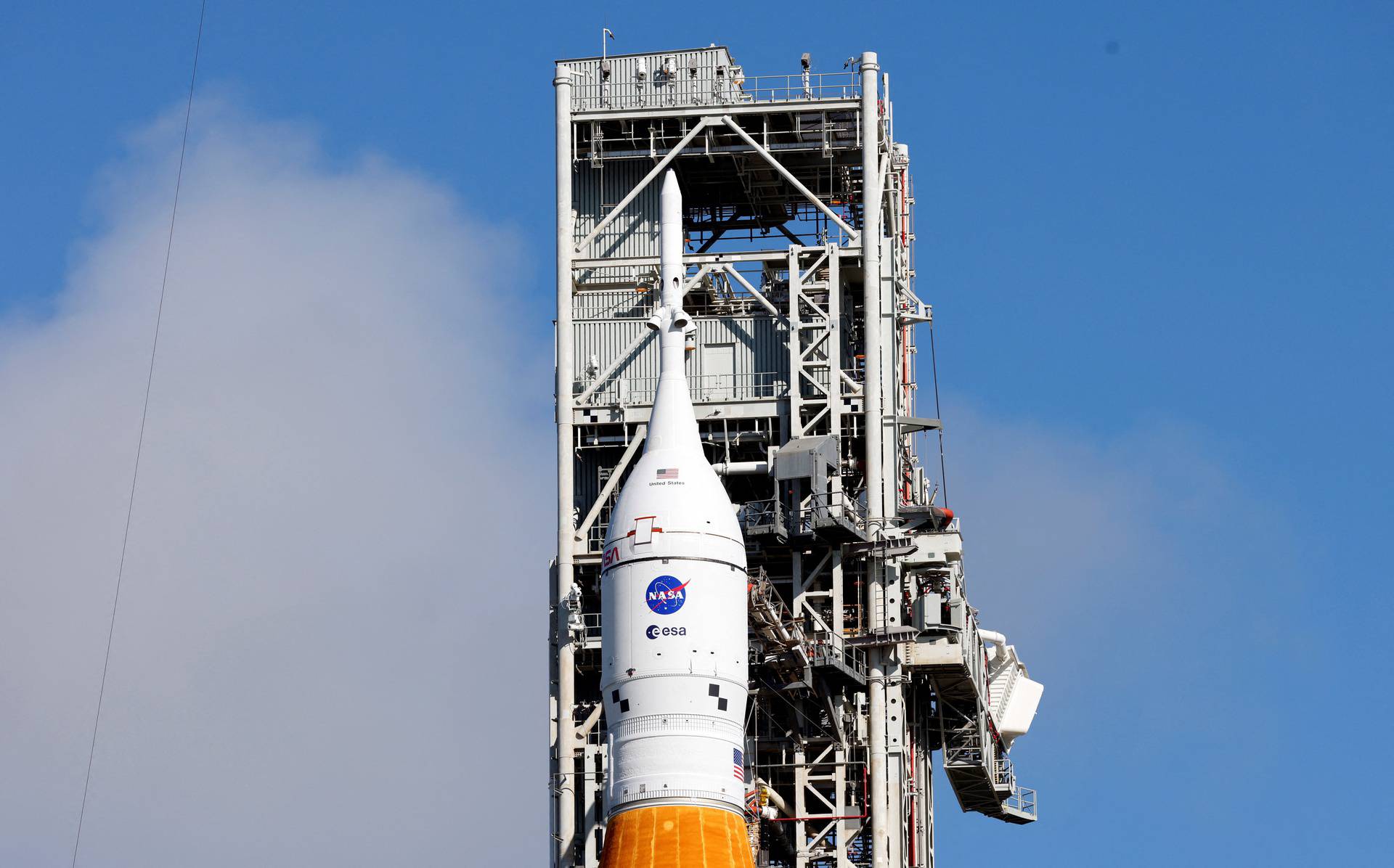 NASA's next-generation moon rocket, the Space Launch System (SLS) rocket with the Orion crew capsule, stands at launch complex 39-B as preparations continue for the Artemis 1 mission