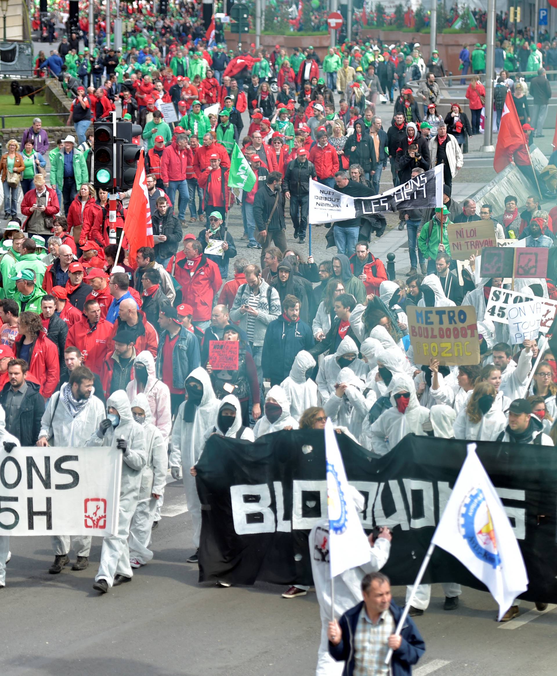 Demonstrators, protesting government reforms and cost-cutting measures, march in central Brussels