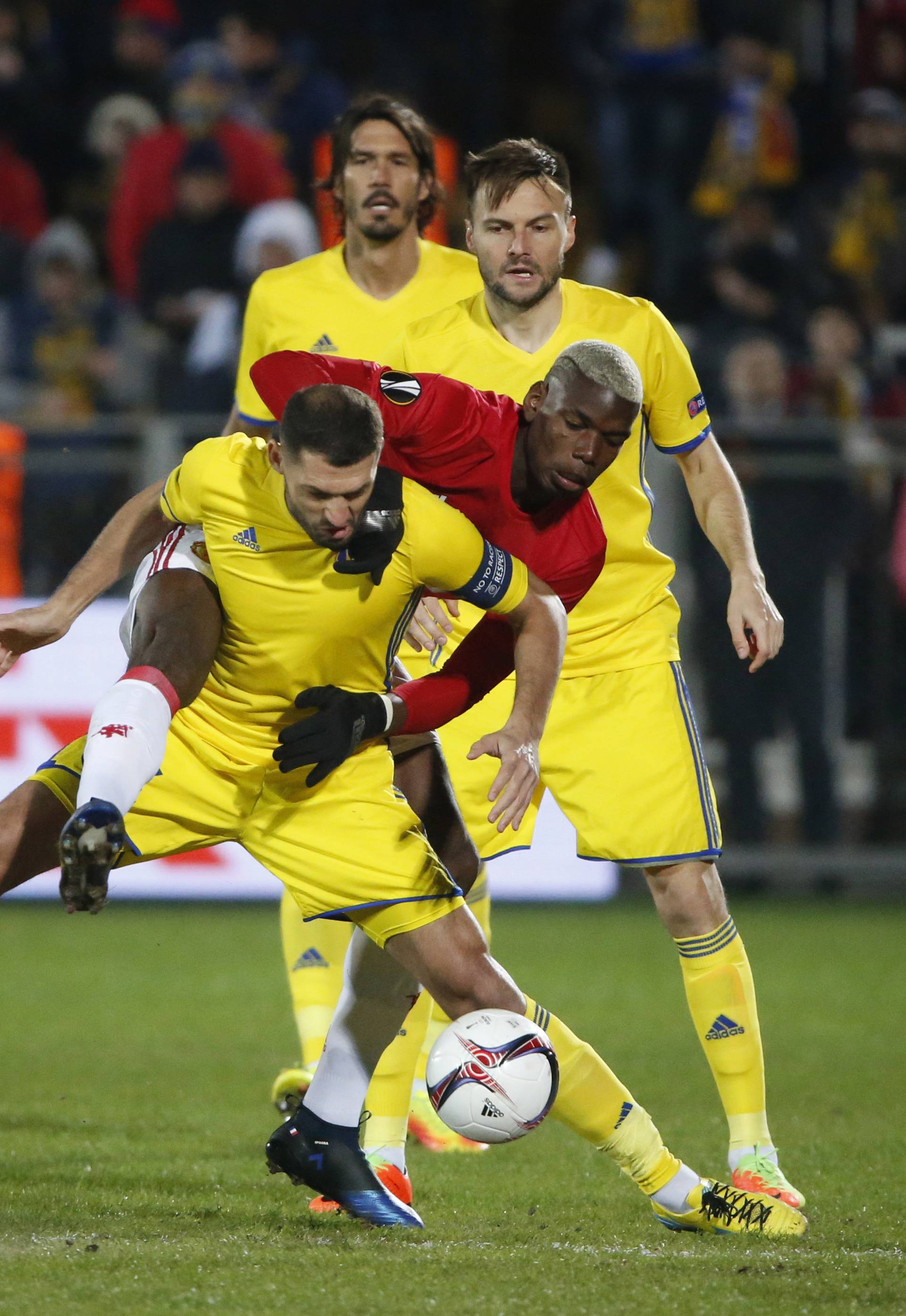 FC Rostov's Aleksandru Gatcan in action with Manchester United's Paul Pogba