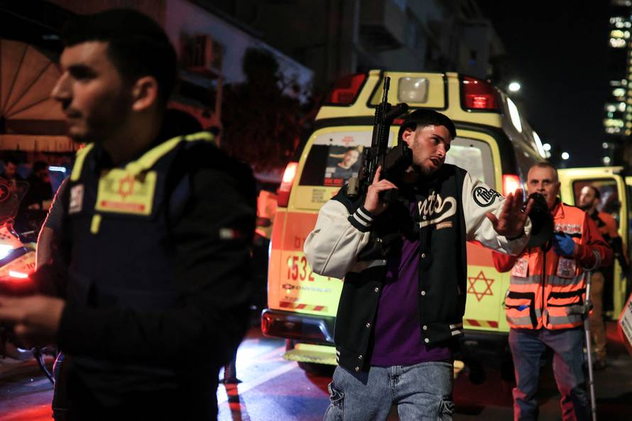Israeli emergency services attend the scene of a suspected attack in Tel Aviv