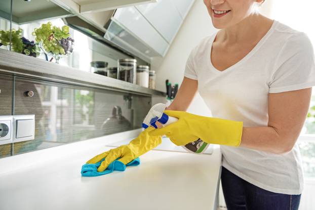 Smiling female person doing cleansing procedure