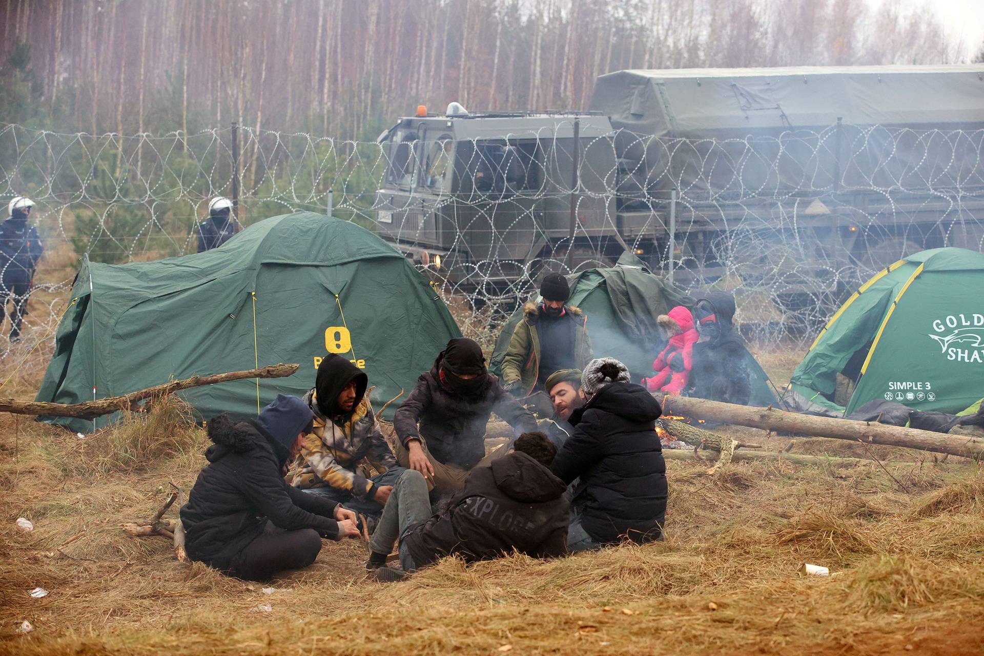 Migrants gather on the Belarusian-Polish border