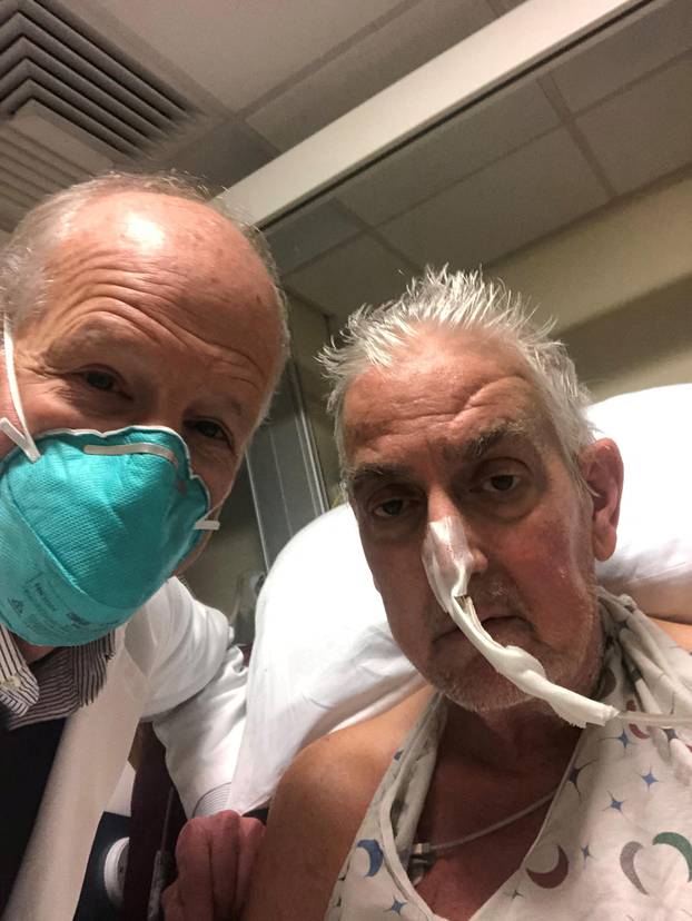 David Bennett poses with surgeon before pig heart transplant in Baltimore