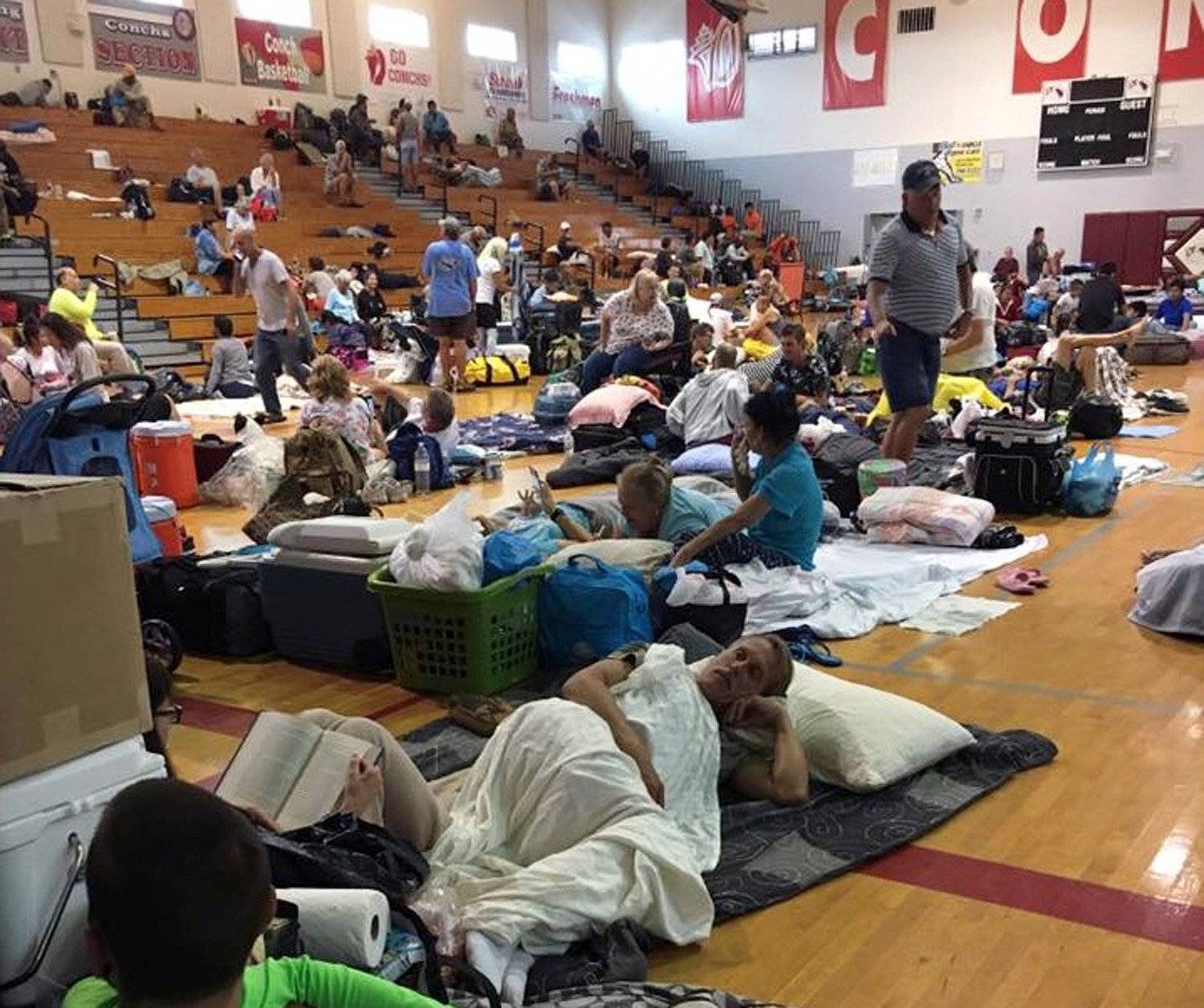 People take shelter at Key West High School in Key West