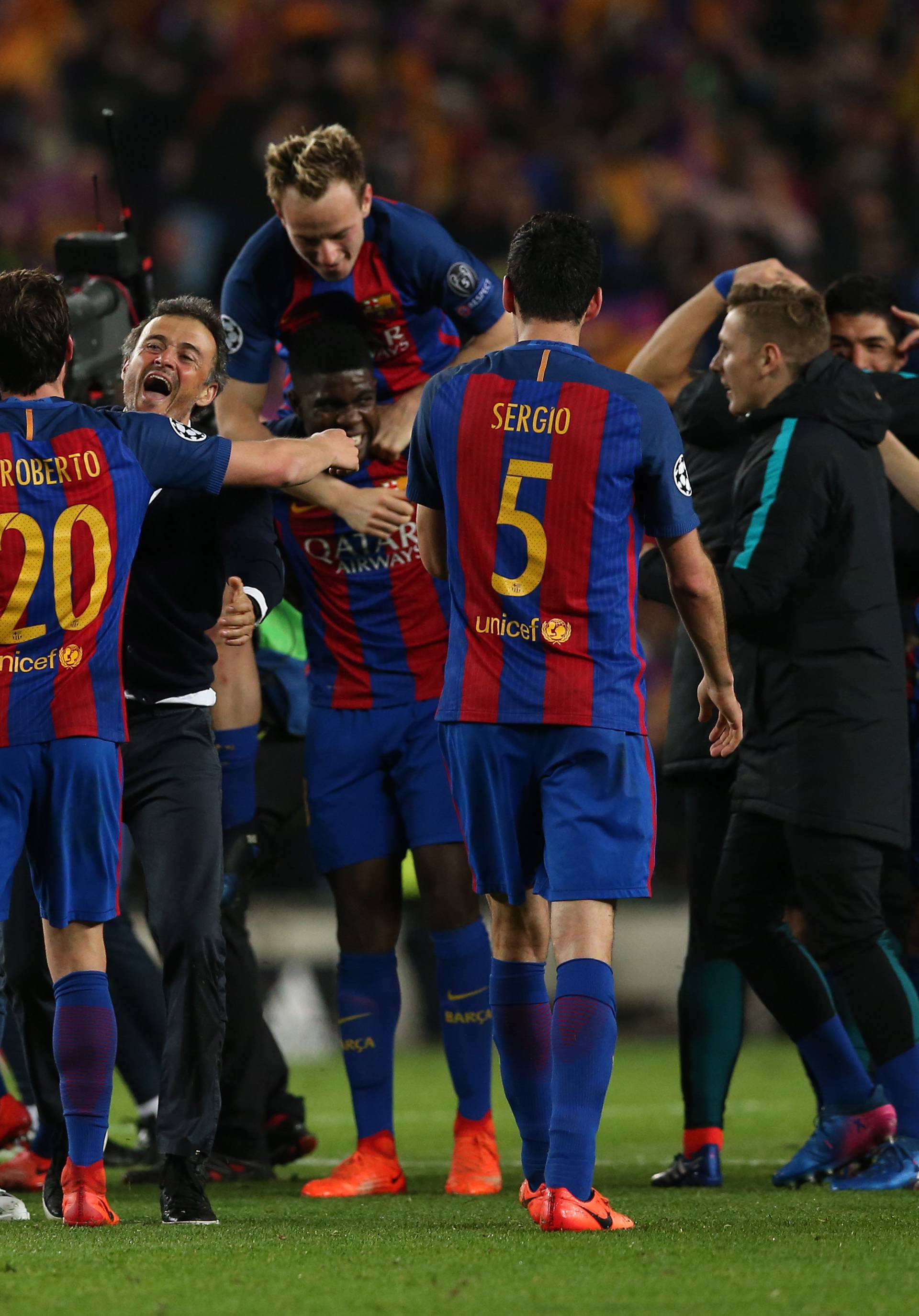 Barcelona coach Luis Enrique and Sergi Roberto celebrate after the game