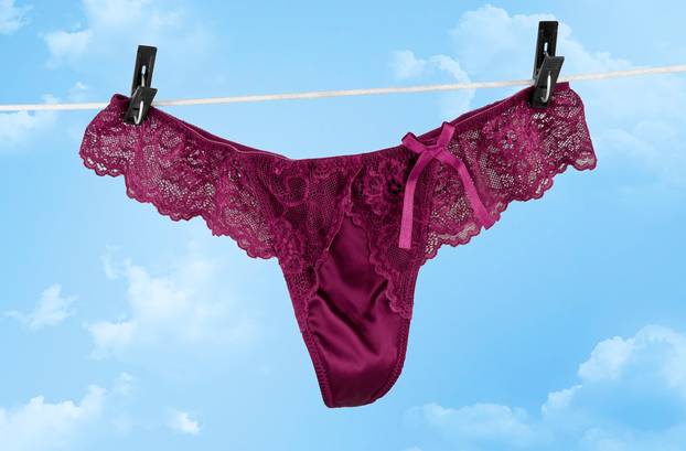 Sexy female underwear drying on rope