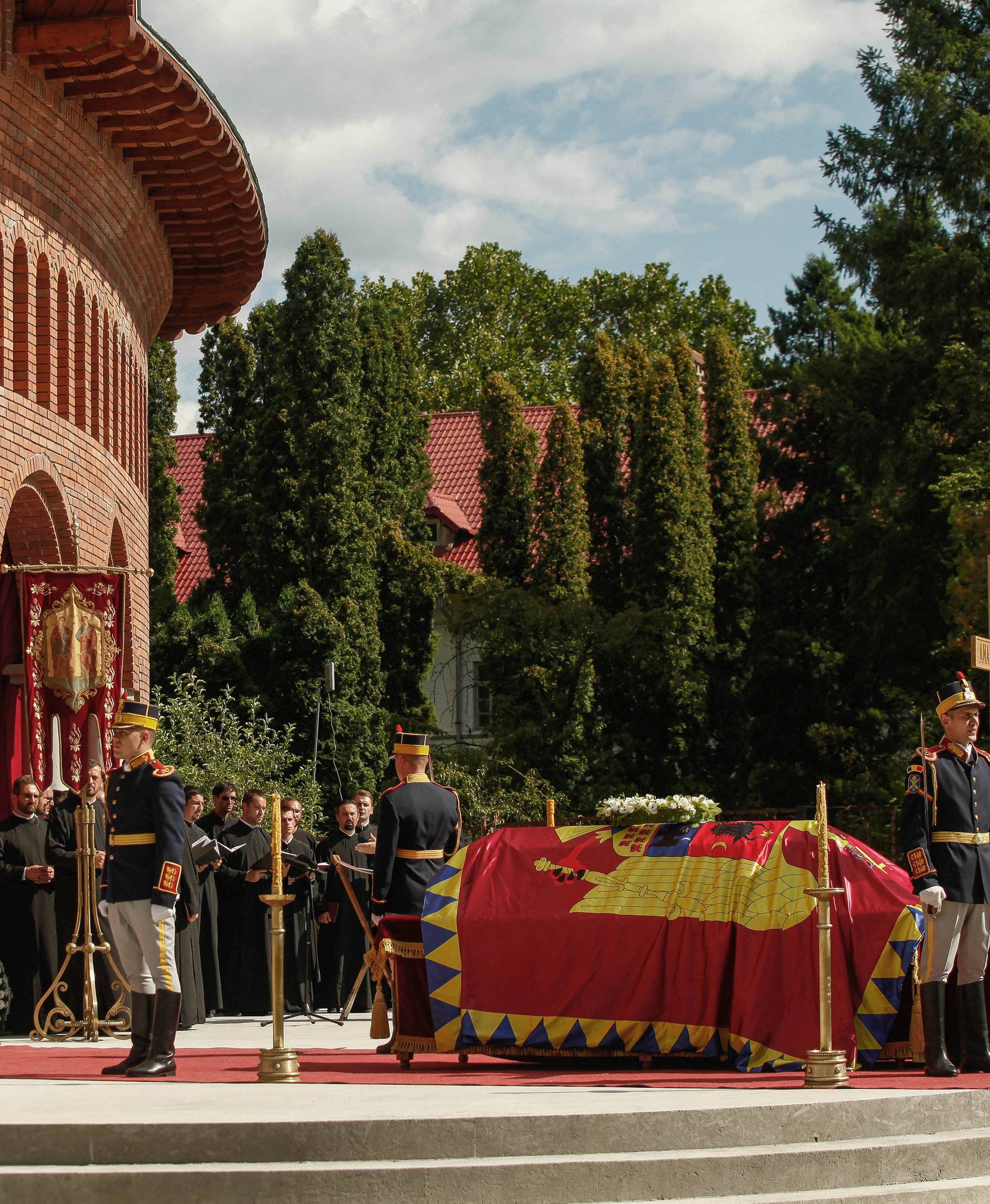 Romanian Orthodox priests perform a funeral ceremony for the late Anne of Romania, wife of Romania's former King Michael in Curtea de Arges