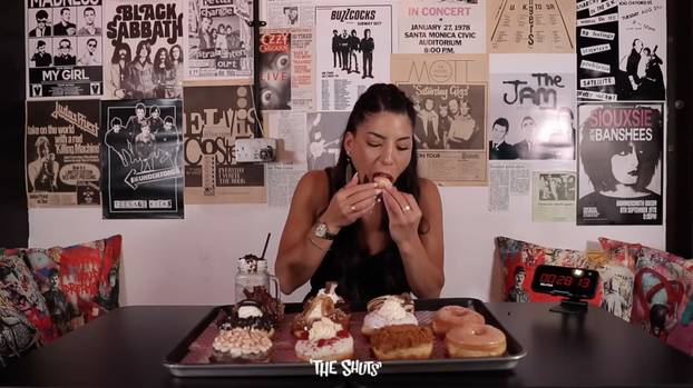 Competitive eater becomes first person to scoff GIANT pile of doughnuts in monster eating challenge – and she loved it