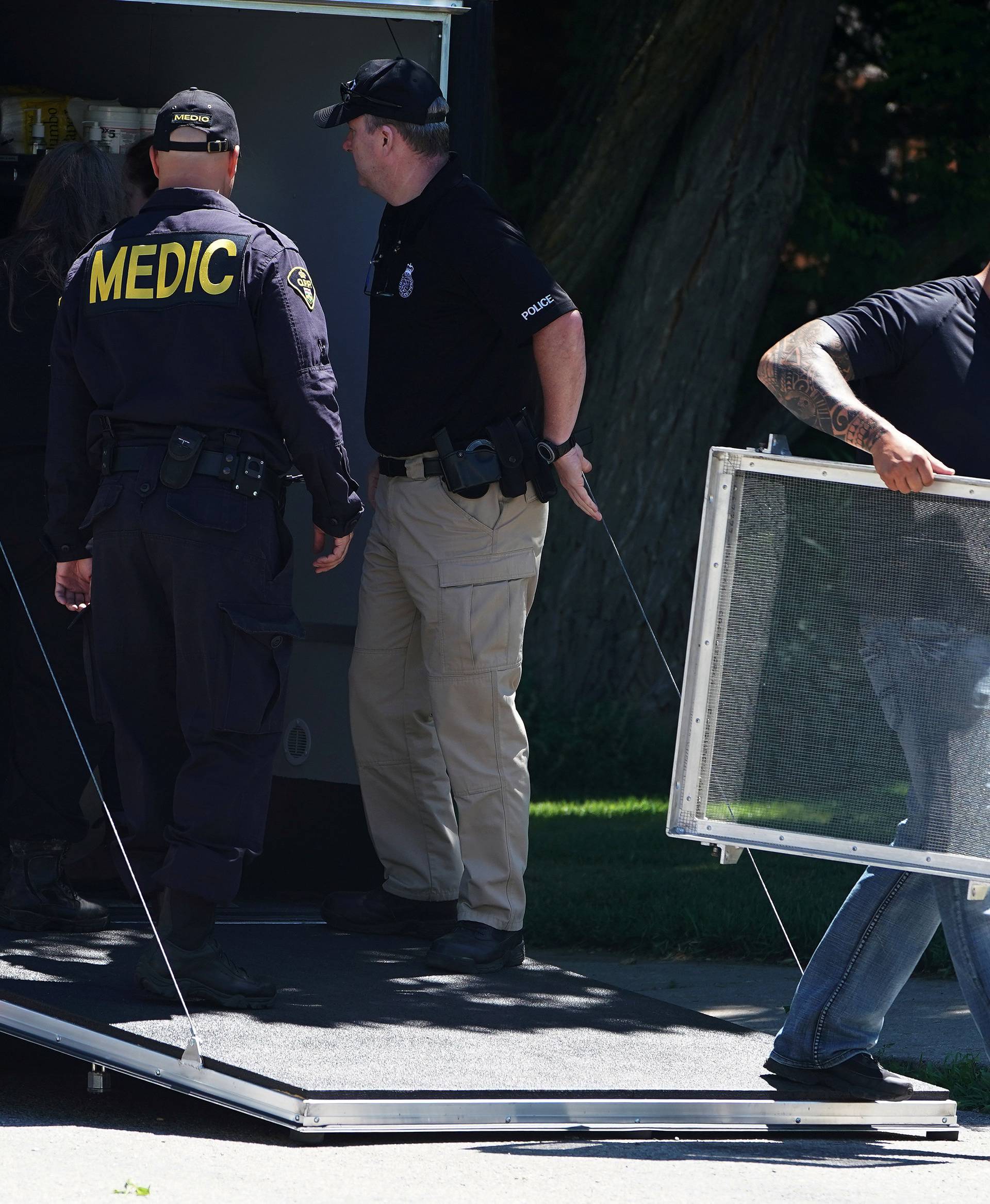 FILE PHOTO: Police officials unload equipment as they continue to investigate a home that accused serial killer Bruce McArthur worked at in Toronto