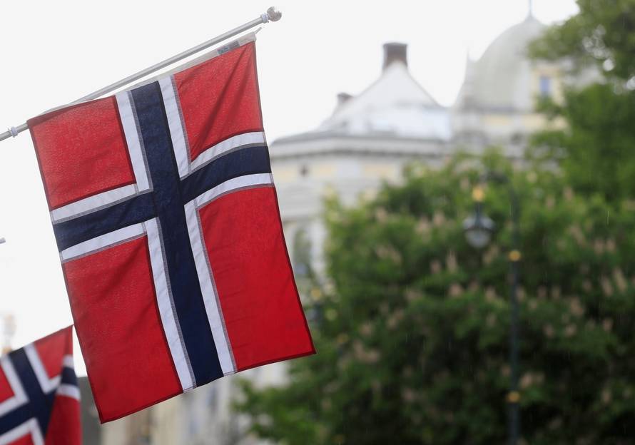 FILE PHOTO: Norwegian flags flutter at Karl Johans street in Oslo