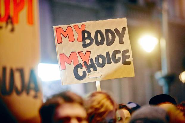 People gather to protest against plans to further restrict abortion laws, in Lodz
