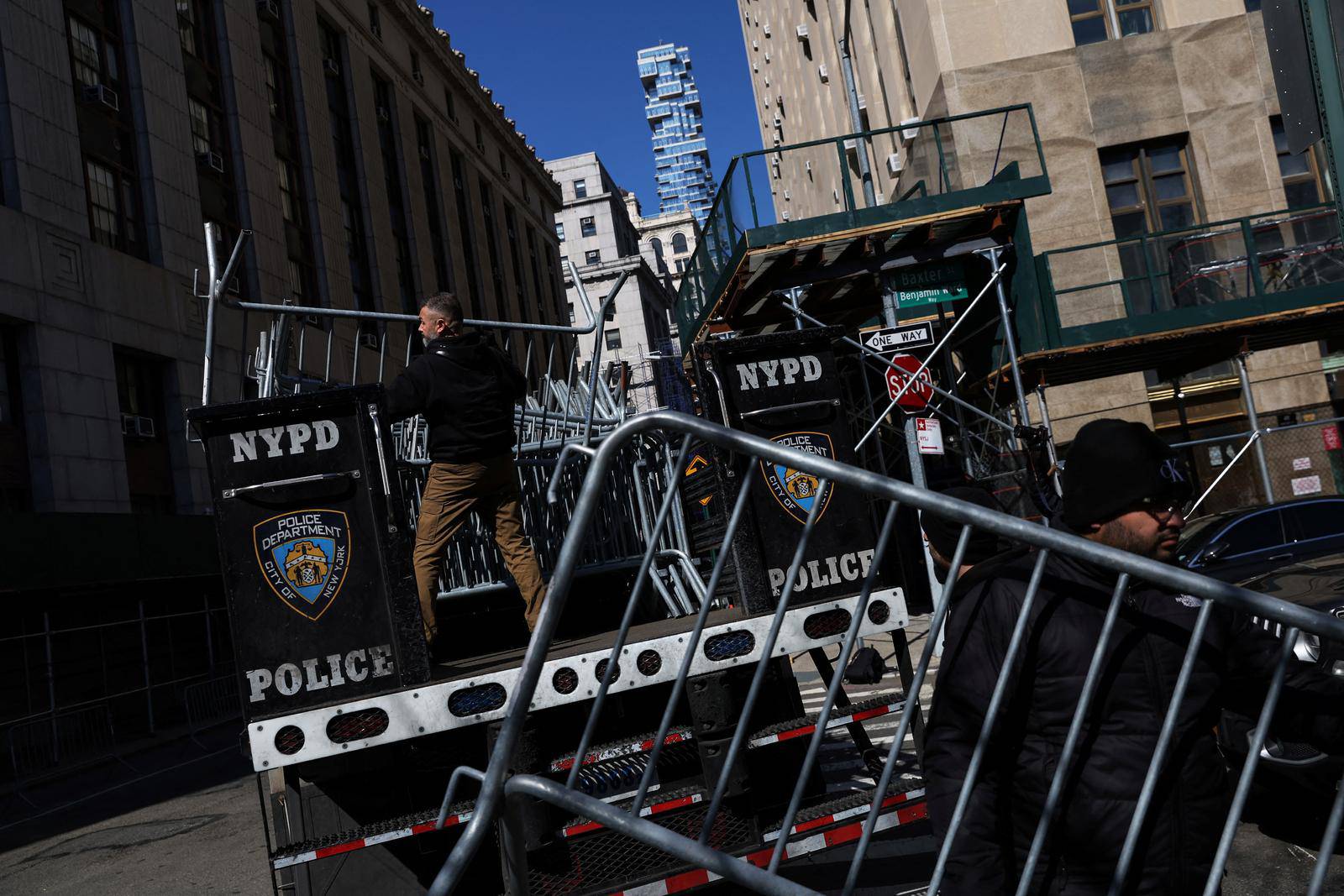 Men set up NYPD barricades outside Manhattan Criminal Court in New York City