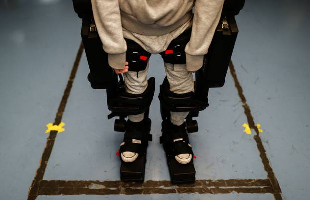 Robot exoskeleton helps wheelchair-bound get up and walk