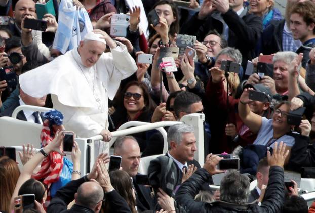 Pope Francis greets faithful from his Papamobile after the Easter Mass at St. Peter