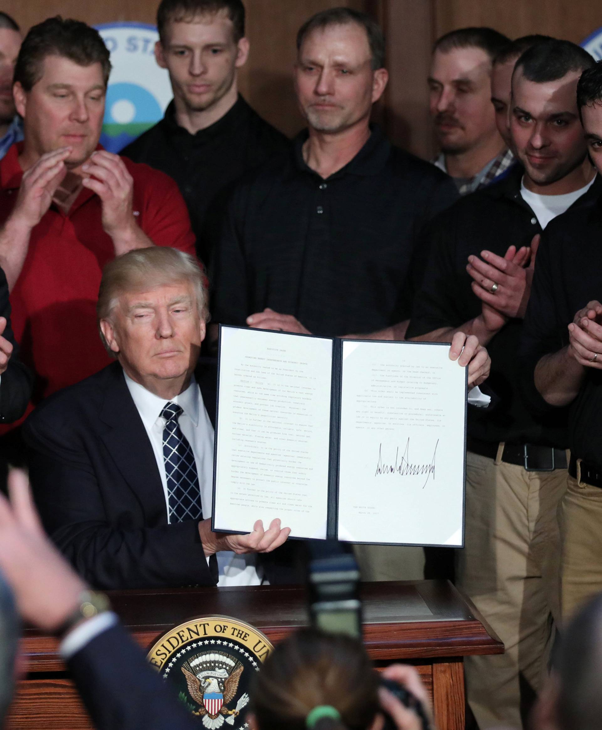 U.S. President Trump displays executive order on "energy independence" during event at EPA headquarters in Washington