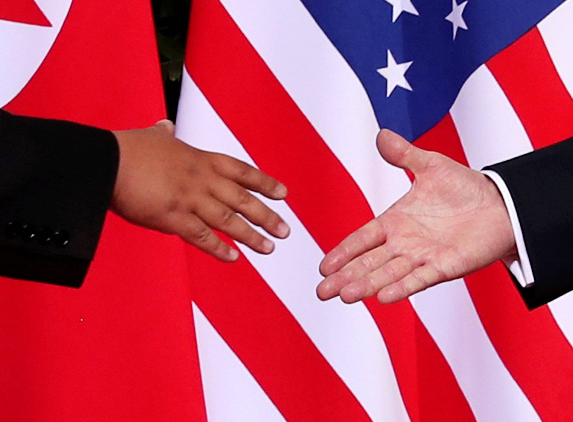 U.S. President Donald Trump shakes hands with North Korean leader Kim Jong Un at the Capella Hotel on Sentosa island in Singapore