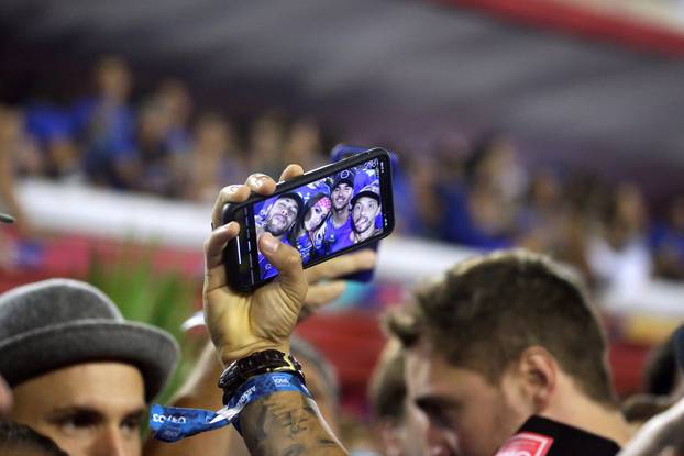 Brazilian soccer player Neymar takes a selfie photo with Brazilian pro surfer Gabriel Medina, Brazilian singer Anita and Brazilian soccer player Nene during the second night of the Carnival parade at the Sambadrome in Rio de Janeiro