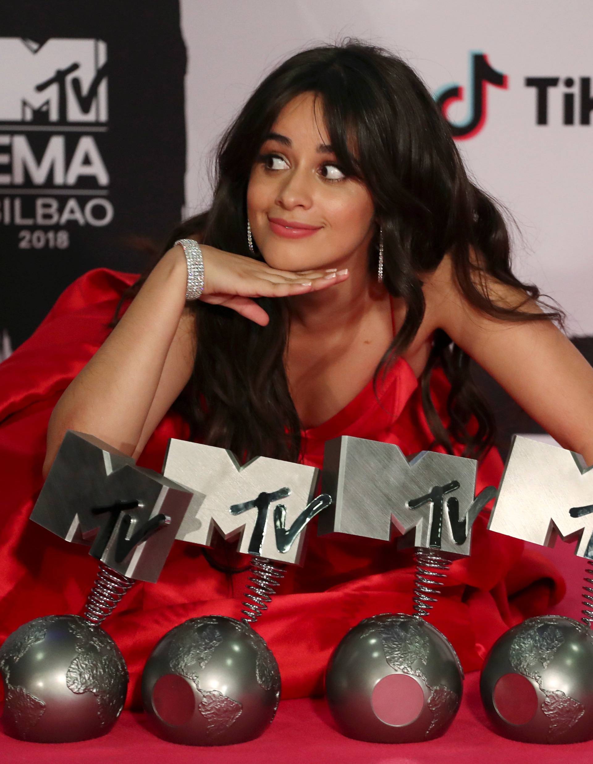 Camila Cabello poses with her awards during the 2018 MTV Europe Music Awards at Bilbao Exhibition Centre in Bilbao