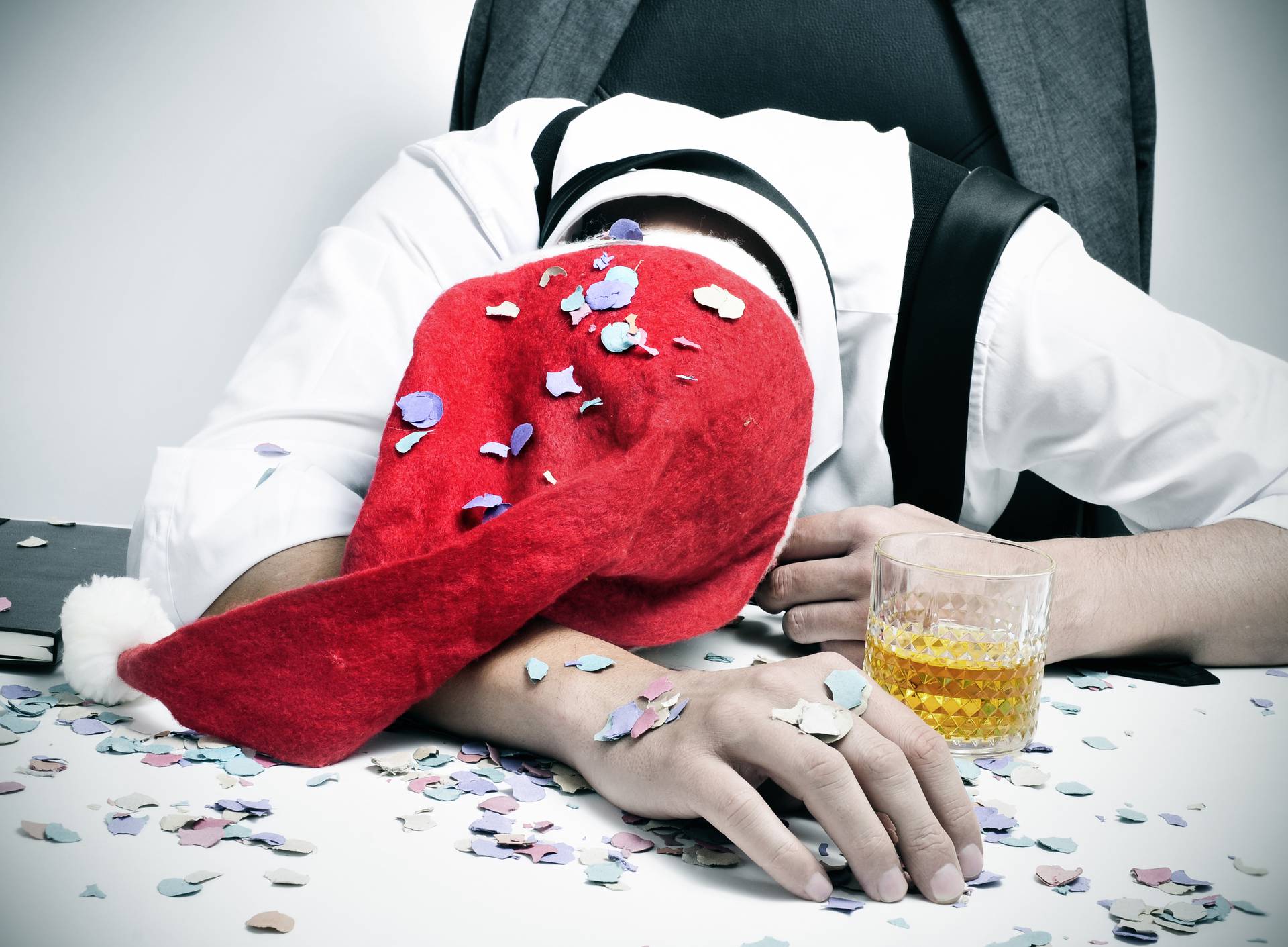 man sleeping in the office after a christmas party