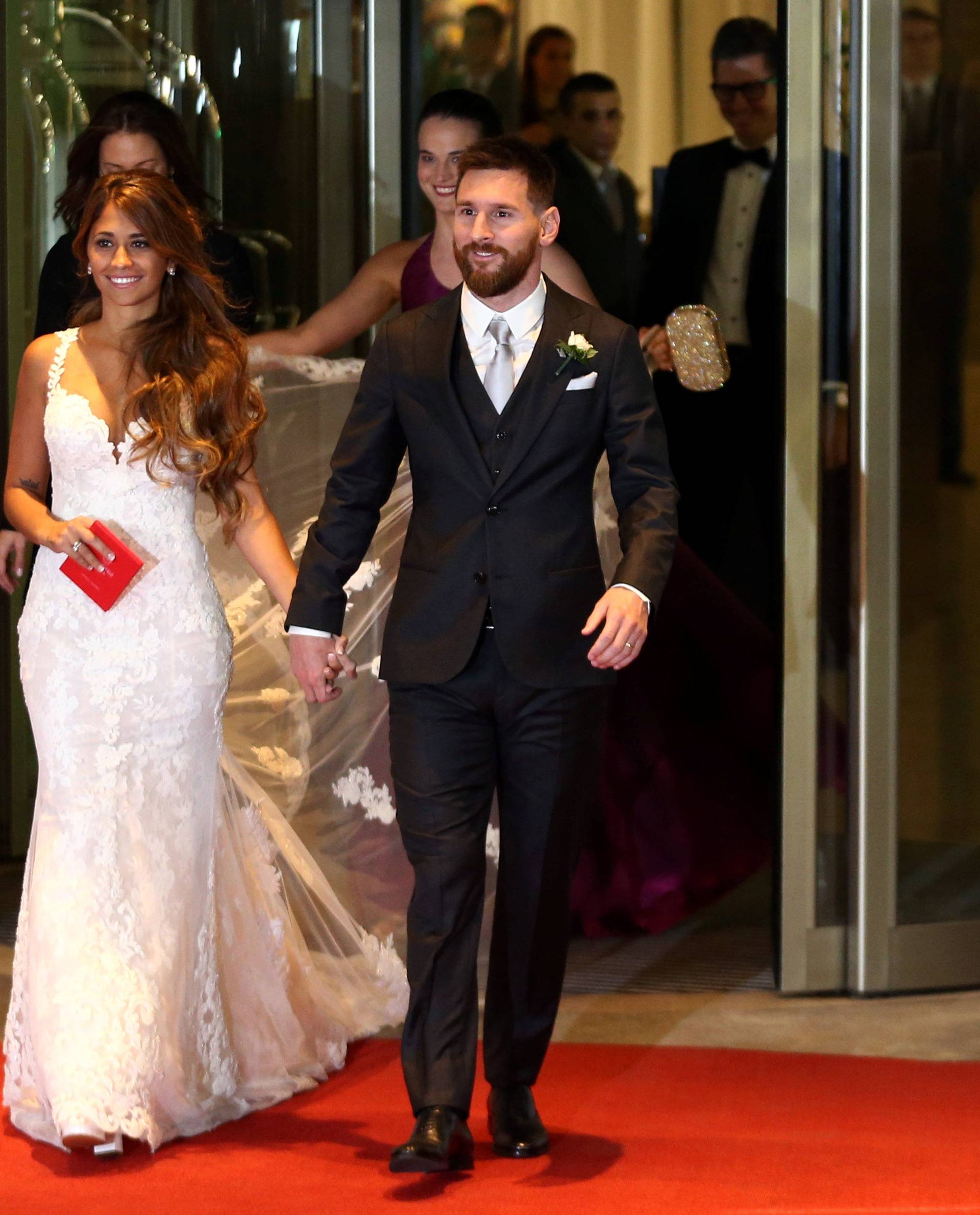 Argentine soccer player Lionel Messi and his wife Antonela Roccuzzo make an appearance for the press at their wedding in Rosario