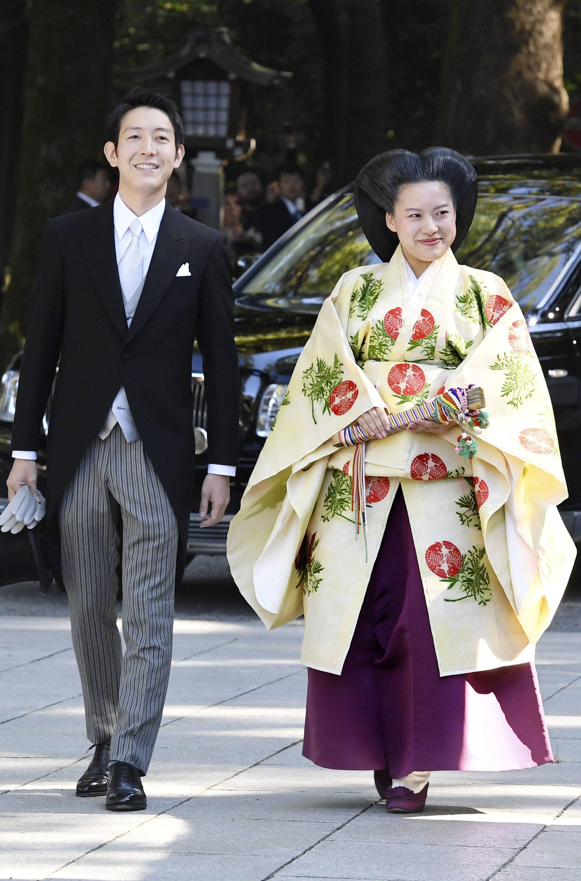 Japanese Princess Ayako and her husband-to-be Kei Moriya arrive at the Meiji Shrine for wedding ceremony in Tokyo