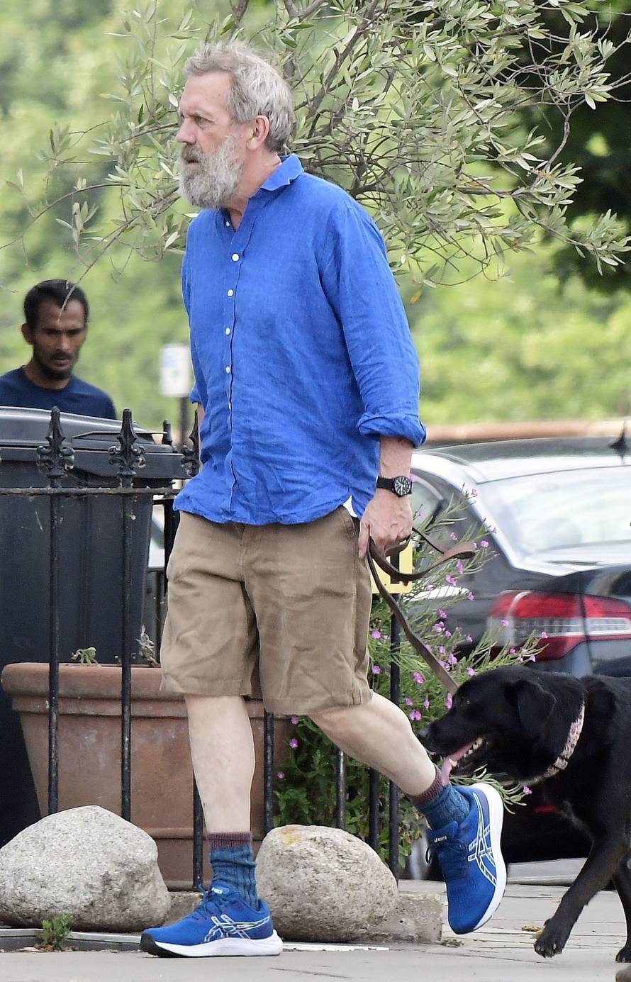 *EXCLUSIVE* STRICTLY NOT AVAILABLE FOR ONLINE USAGE UNTIL 22:00 PM UK TIME ON 02/08/2022 - WEB MUST CALL FOR PRICING  - 

The English Actor Hugh Laurie cuts a rather dishevelled look during his jaunt out walking the dog in North London.
*PICTURES TAEKN ON
