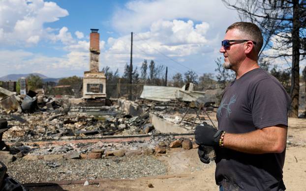 Luke Opperman at his burned home at Hawk Fire in Reno