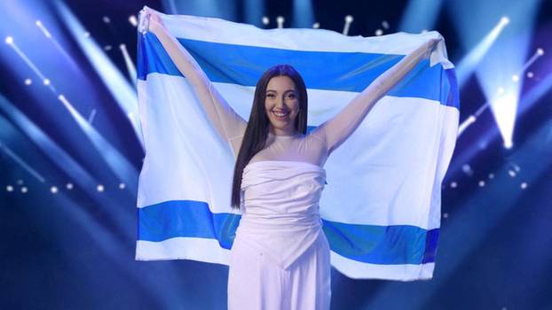 Israel's representative to the Eurovision Song Contest, Yuval Raphael, a survivor of the deadly October 7 2023 attack by Hamas on the Nova festival in Israel's south, holds an Israeli flag