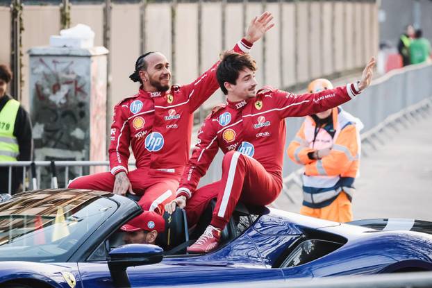 Milan, The Scuderia Ferrari HP Drivers' Presentation by UniCredit event with the passage of the Formula 1 single-seaters driven by the team's drivers on the city circuit in Piazza Castello