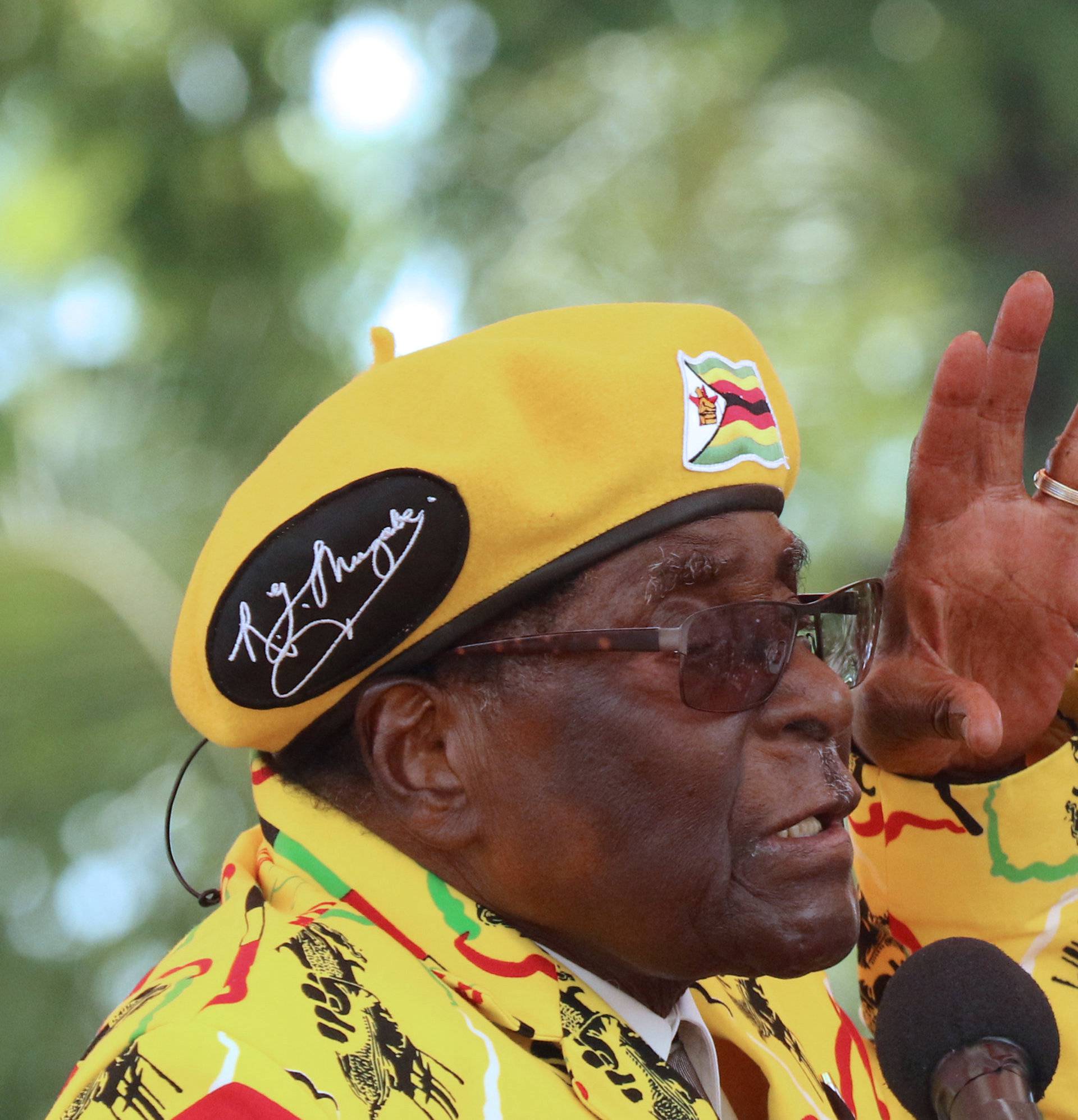 President Robert Mugabe gestures as he addresses a rally in Harare