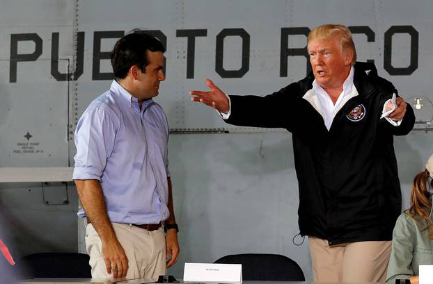 FILE PHOTO: Trump talks to Puerto Rico Governor on trip to survey damage from Hurricane Maria in Puerto Rico